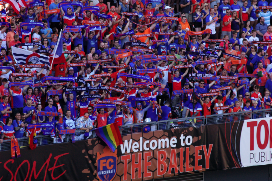Orchestra teacher Chris Gibson (center, front row) celebrates with other FC Cincinnati Fans in the Bailey at the University of Cincinnati. FCC has revitalized the soccer fandom in the city, and brings nearly 30,000 fans to each game.