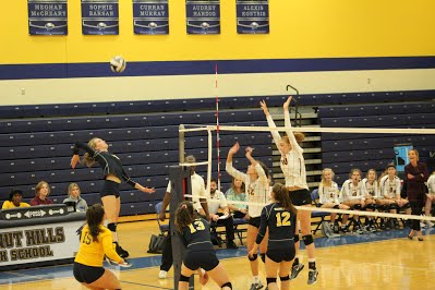 Olivia Tombragel, ‘20 leaps to spike a set from a teammate. This is Tombragel’s fourth year with the program.