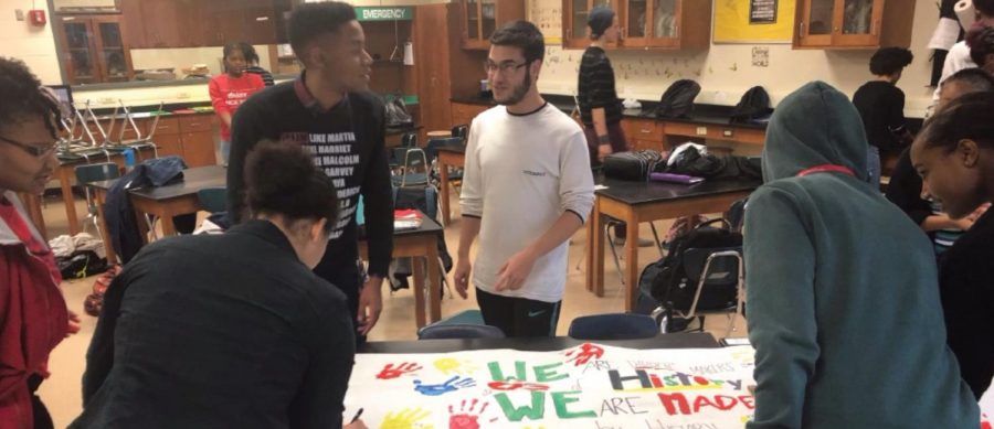 Members of Black Culture Club work on a poster that will later hang in the Forum. Black Culture Club has been planning their festivities in recognition of the month for weeks, even coming into school on snow days to prepare.