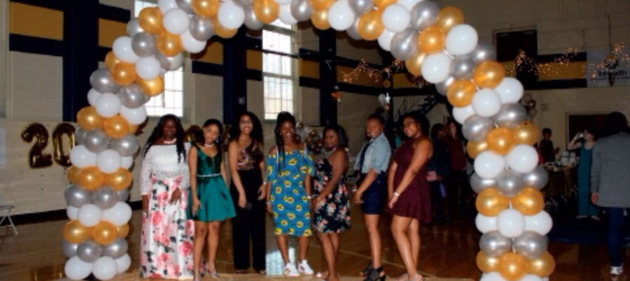 Junior high students pose for a picture at the annual Twilight Ball dance. Colorful decorations adorned the Junior High Gym around them as their classmates danced and enjoyed the night.