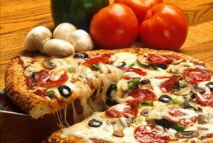 This is an example of a delicious-looking Supreme Pizza, one of the most common pizza specials across the nation. A pizza place without good specials, or specials that lack the essence of the locality surrounding their establishment, is a failure of a pizza restaurant.