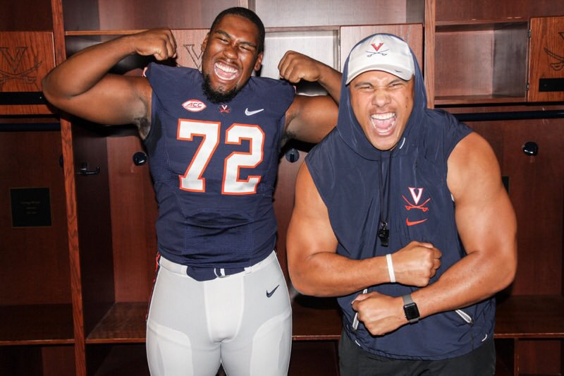 Jowon Briggs, 19, with D-Line coach Vic So’oto after committing to Virginia.