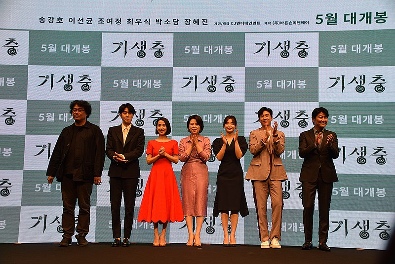 Director Bong Joon-Ho applauds with the cast of Parasite at an April 2019 press event. Writer, SENIOR Matthew Proietti, ranked Parasite as one of the best movies of 2019.