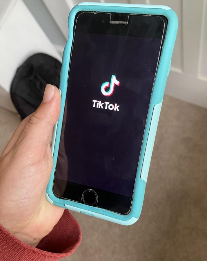 A student opens the TikTok app to scroll through the entertaining videos on their for you page. TikTok is possibly getting banned in the near future for national security reasons.
