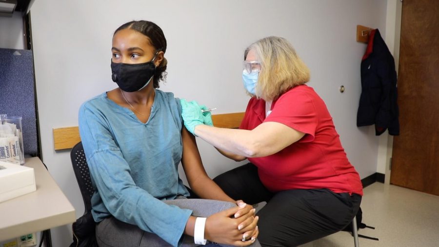 Melanie Mitchell, 22, was one of the first young, Black women to participate in COVID-19 vaccine trials. 