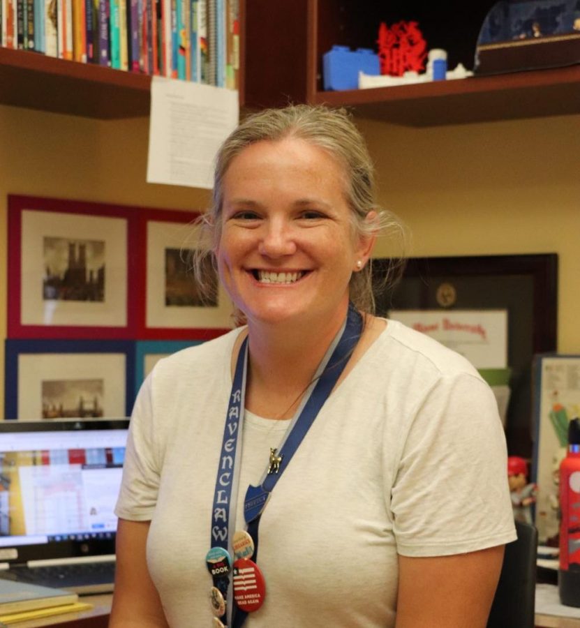 All smiles! Ms. Riggs shows off her office in the library. Riggs has been hard at work since the start of the school year and is excited to interact with more students. “I love when a student finally finds the right book for them, and they’re really excited about it,” said Riggs. 