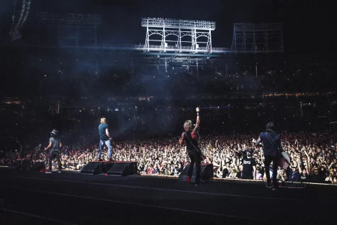 The current lineup of Guns N’ Roses (from left to right, Slash, Axl Rose, Duff McKagan, and Richard Fortus) play at Wrigley Field on Sept. 16. This reunion follows a nearly 25 year long split between guitarist Slash and singer Rose that resulted in a drastic shift in creativity and sound… for the worse.