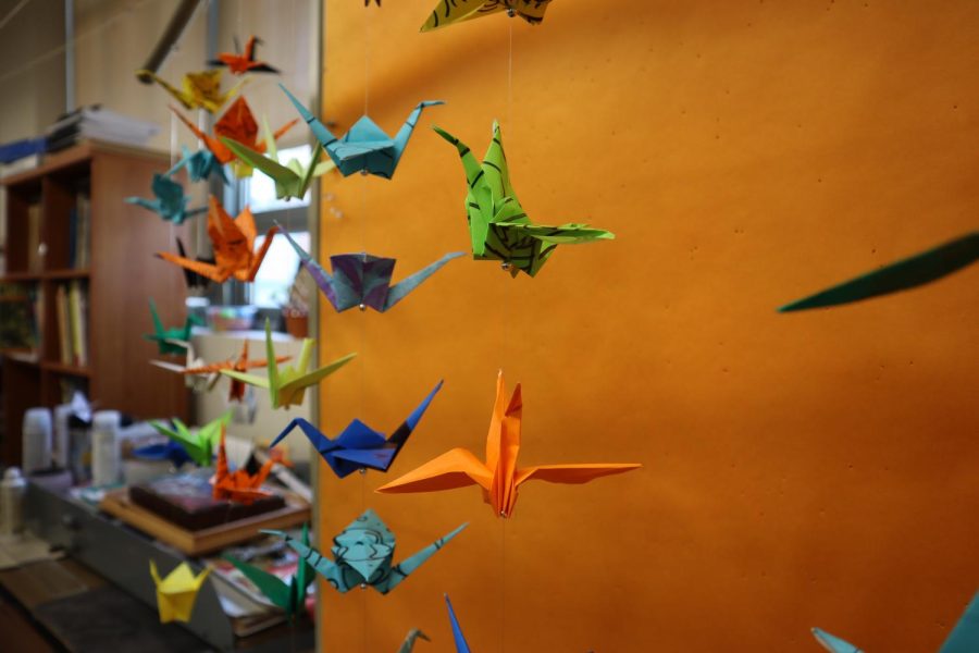 The art club is taking on the 1000 cranes project, where they fold 1000 cranes and hang them all around the school. The first mobile was recently put up in the forum to create a happy environment for WHHS students.
