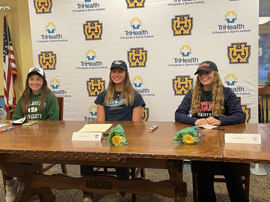 SENIORS Sophia Cuchetti, Ava Stallmeyer, and Phoebe Wright all signed their letter of commitments to their respective colleges on Nov. 10. Cuchetti will be playing soccer at Cleveland State, Stallmeyer will be swimming at Bucknell University, and Wright will be swimming at George Washington. 