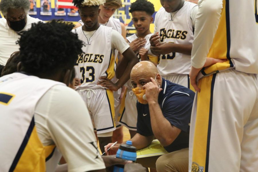Coach Ricardo Hill talks to his team during a timeout at the WHHS boys varsity game against Lebanon on Jan. 14.