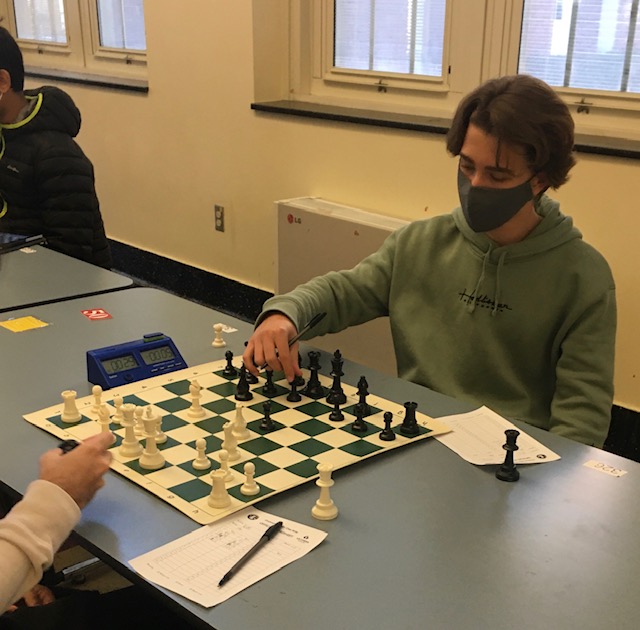 Alex Krol, ‘24, competes in WHHS’ chess tournament on Jan. 8. This is Krol’s third year as a member of the chess club and he placed third in his division. “It’s so much fun and people dont realize it. At first, they think its like some nerdy boring game. I get it, but also once you understand how the game works, its crazy what can happen because of how many tricks and traps there are,” Krol said.