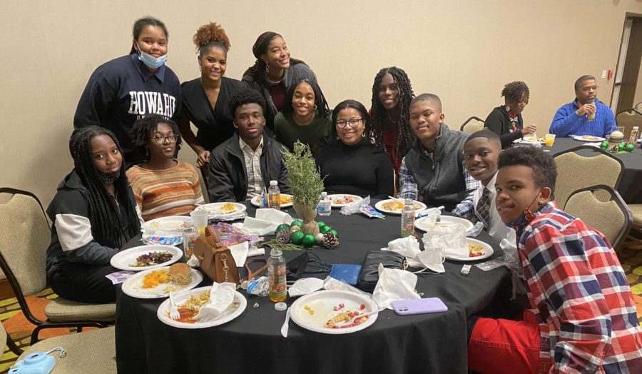 At their Annual Jack and Jill Family Holiday Event, Wilkerson and Nelson gather around with family and friends from the organization, celebrating all their hard work from the year.