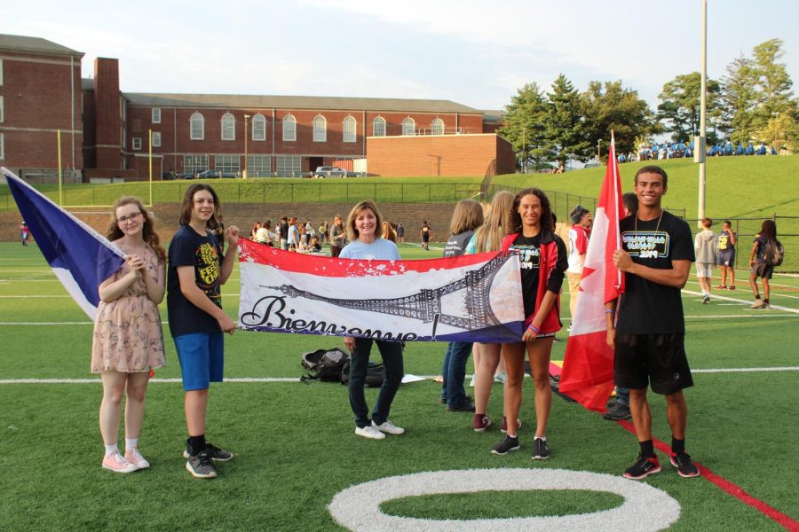 French club members prepare for the upcoming school year at this year’s Homecoming Parade on South Field.