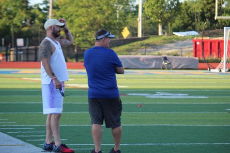 Mike Roberts and new assistant coach Taylor Trimboli discuss practice plans. With two entirely new coaches, the team is going through a lot of change this year. 
