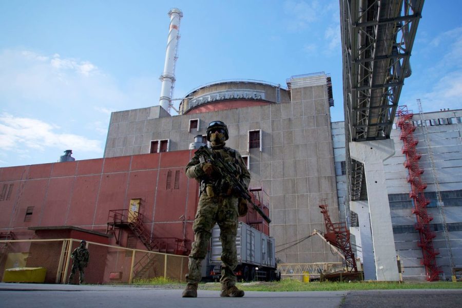 A Russian soldier stands guard at the Russian controlled Zaporizhzhia Nuclear Power Plant in southern Ukraine, May 1, 2022.