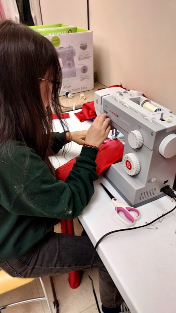  SENIOR Paloma Lancador is working hard on a costume piece for the fall play Macbeth.
