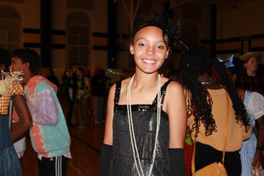 Abi Melesse smiles for the camera dressed as a flapper girl.