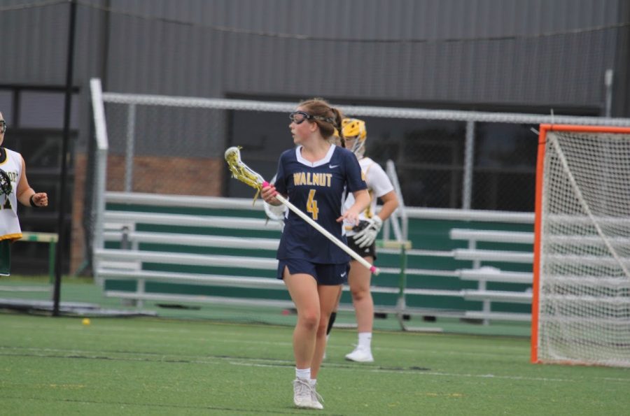 As spring sports commence, SENIOR Brooklyn Shafer plays lacrosse with her teammates.