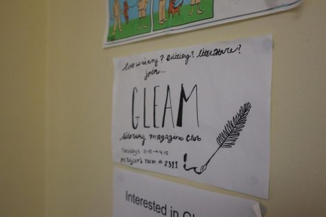 A sign for Gleam, the publication that hosted Writing on the Wall. 