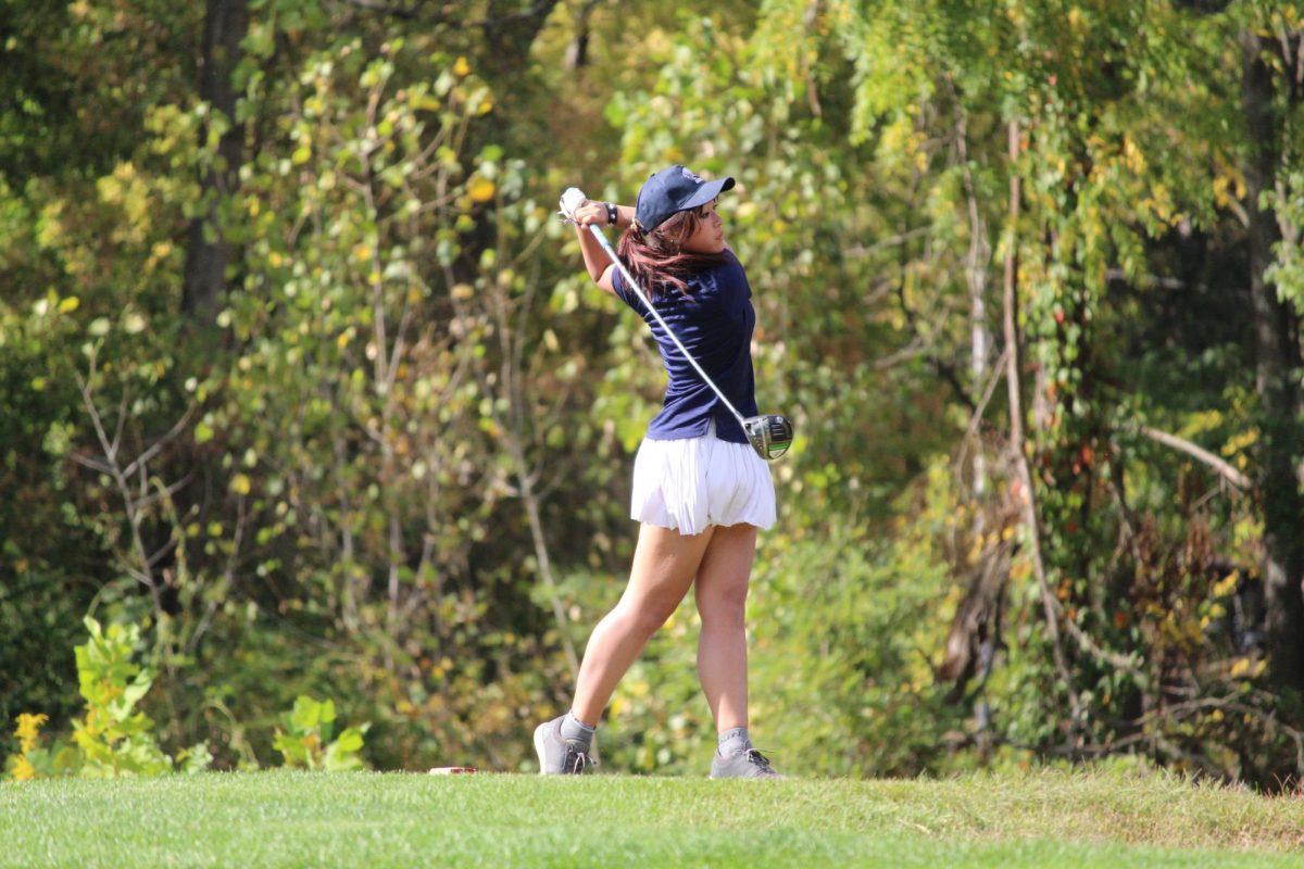 Ash Kertpet, '27, is teeing off during her golf match in Lebanon.
