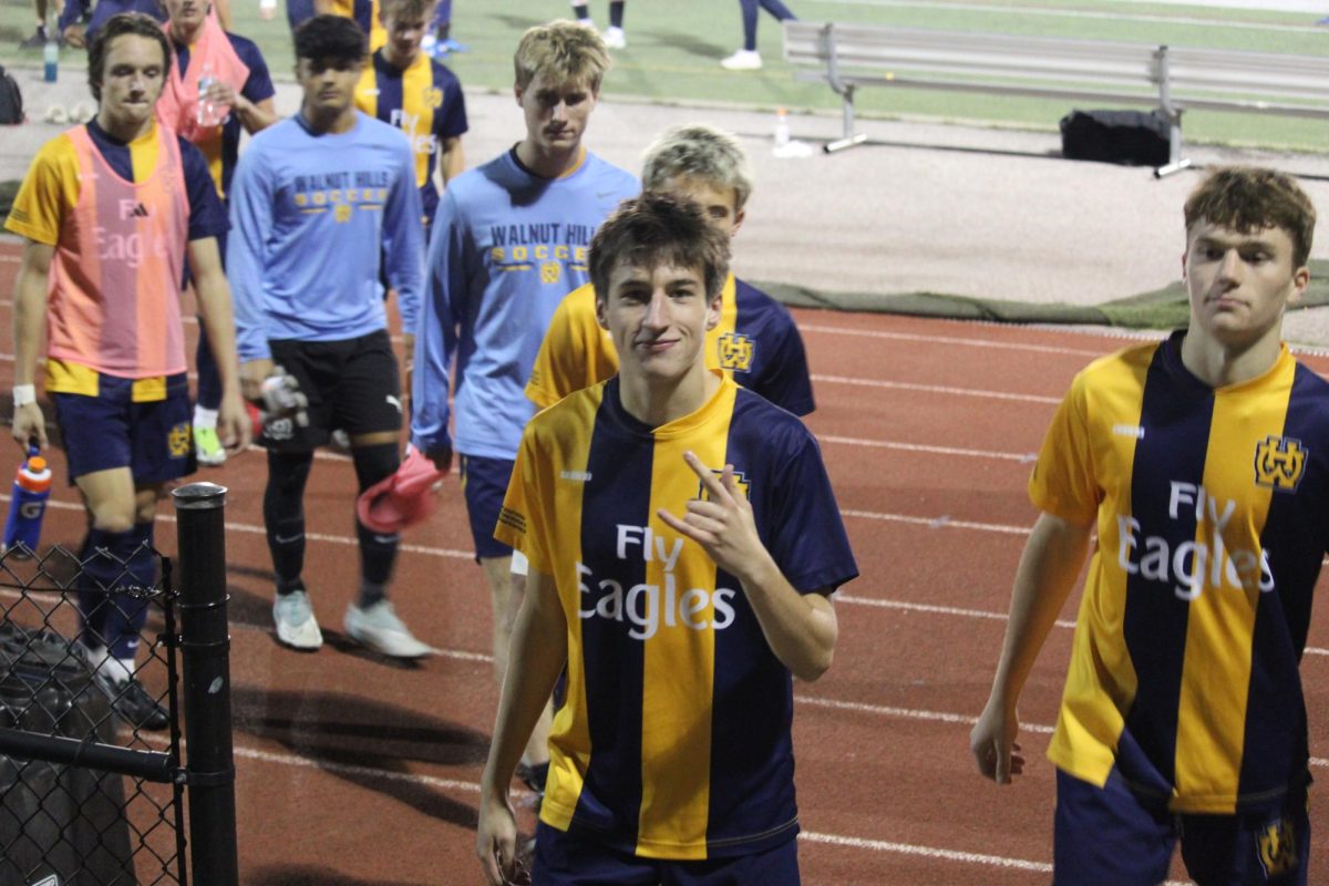 Jacob Naberhaus, '25, strikes a pose as the soccer team heads in to the locker room for halftime in good spirits.