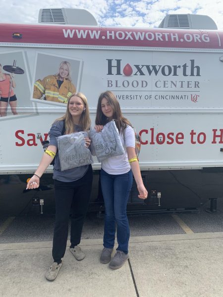 Charlotte Long, ‘25 and Greta Koehn, ‘25 pose in front of the Hoxworth Bloodmobile after donating blood. “Anybody who donated or tried to donate, even if they got there and couldn’t, got a [free] sweatshirt from Hoxworth,” John Caliguri said.
