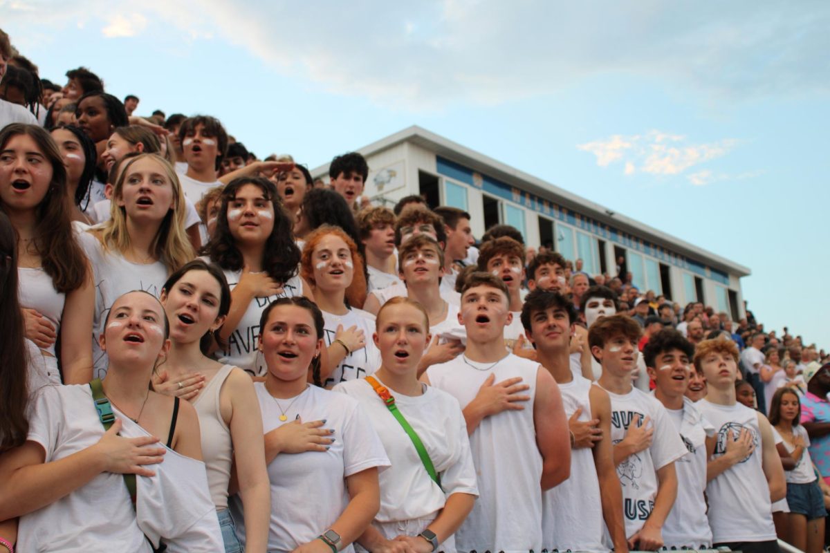 The Nuthouse shows their support during the football game against Milford in their white out/white lie attire. 