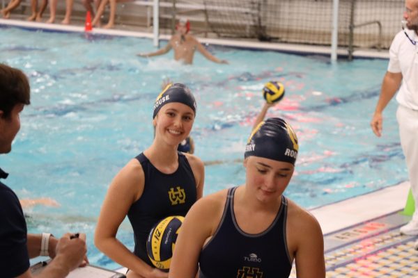  Coral Morehouse, ‘27, ecstatically supports the boys’ water polo team as they fight for another win. 
