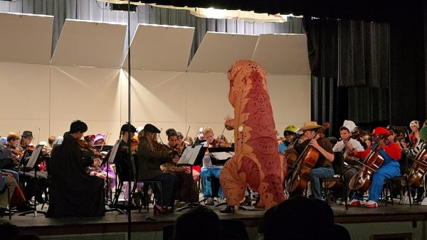 After a costume change Chris Gibson wore this popular dinosaur costume while conducting the Chamber Orchestra during the performance. “There’s a lot of good music that gets ignored, a lot of sneaky themes that you know, if your concert is in November and you play a Halloween piece, you’re like, well you kind of missed [it], it was a month ago,” Gibson said.