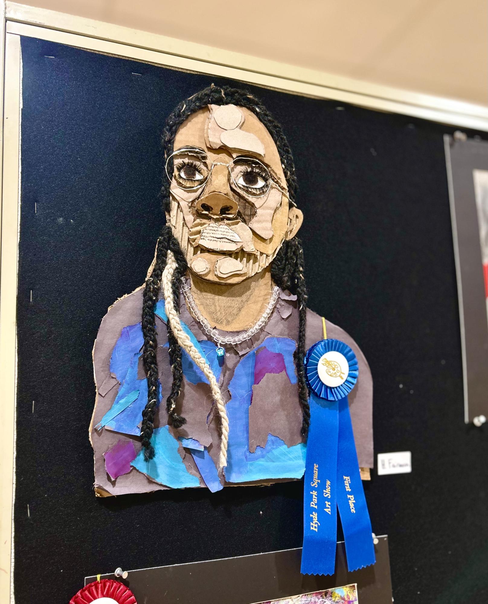 Haviland Fairman, ‘25, one of the student’s in the AP 3D design class, made this self-portrait out of cardboard and colored paper. The portrait won first place at the Hyde Park Square Art Show.
