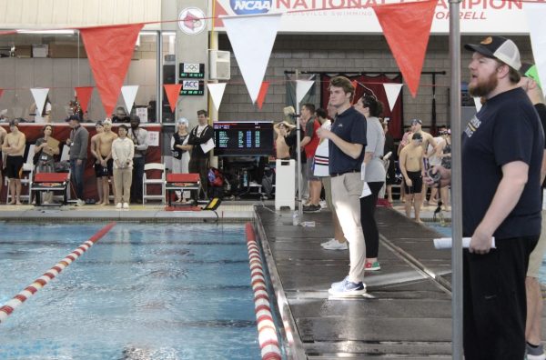 New head coach JC Prugh works with swimmers on his club team, YMCA BASH.
