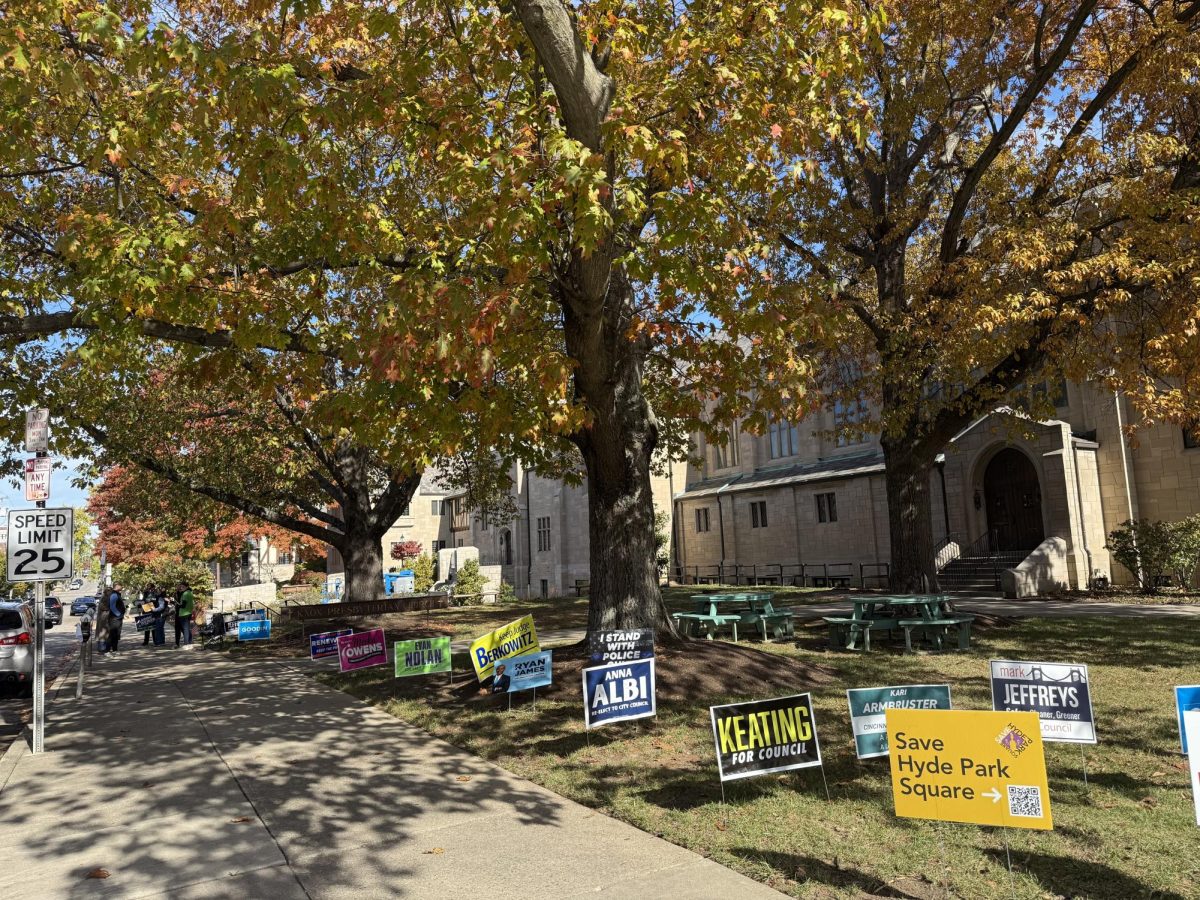 Various campaign signs are displayed outside Knox Presbyterian Church in Hyde Park on Election Day, Nov. 4, where neighbors go to vote.