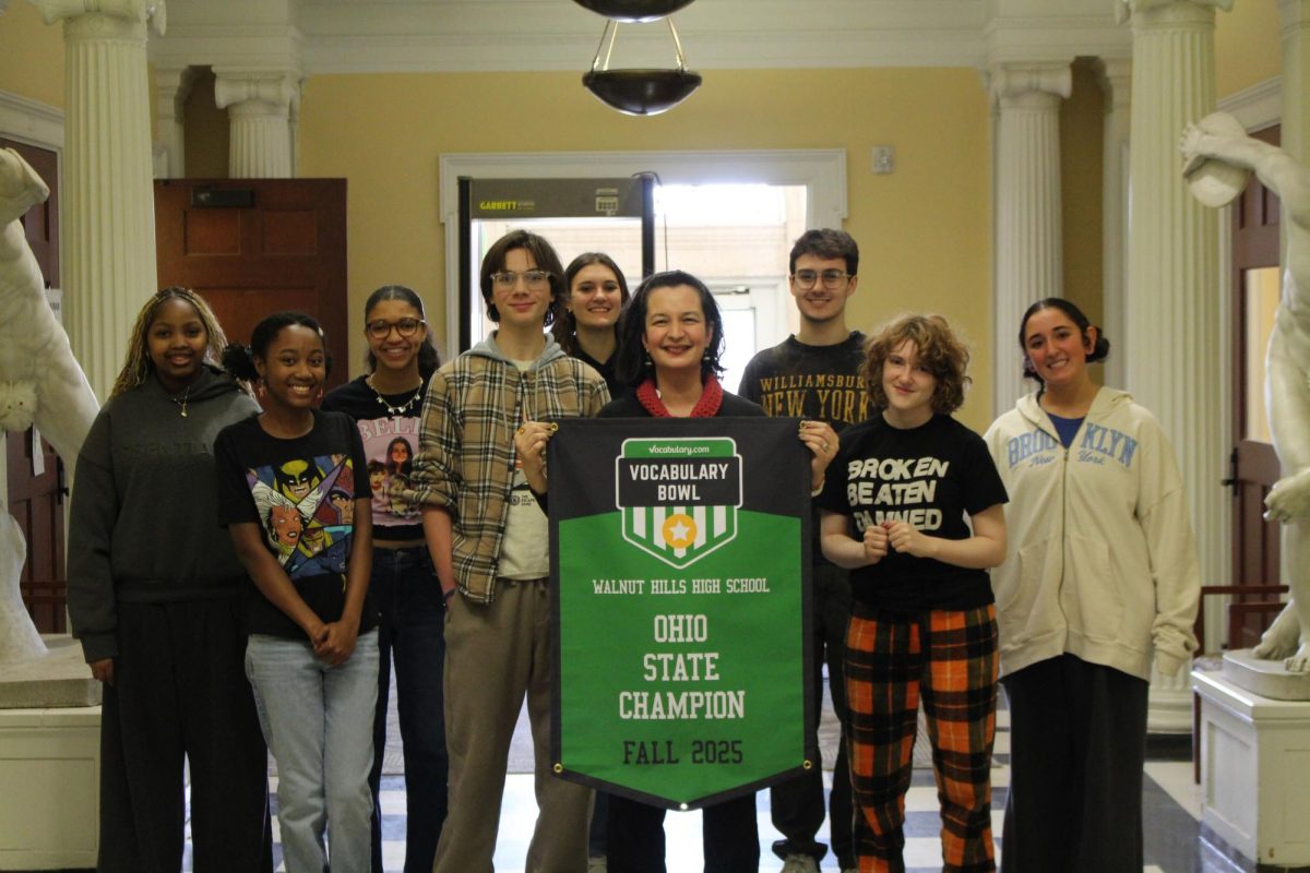 English teacher Christine Minano and some of her English 10 students receiving the Ohio State Champion banner on behalf of WHHS. 